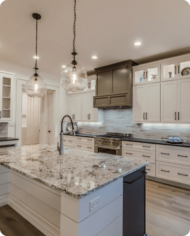 Modern kitchen with marble island countertop.